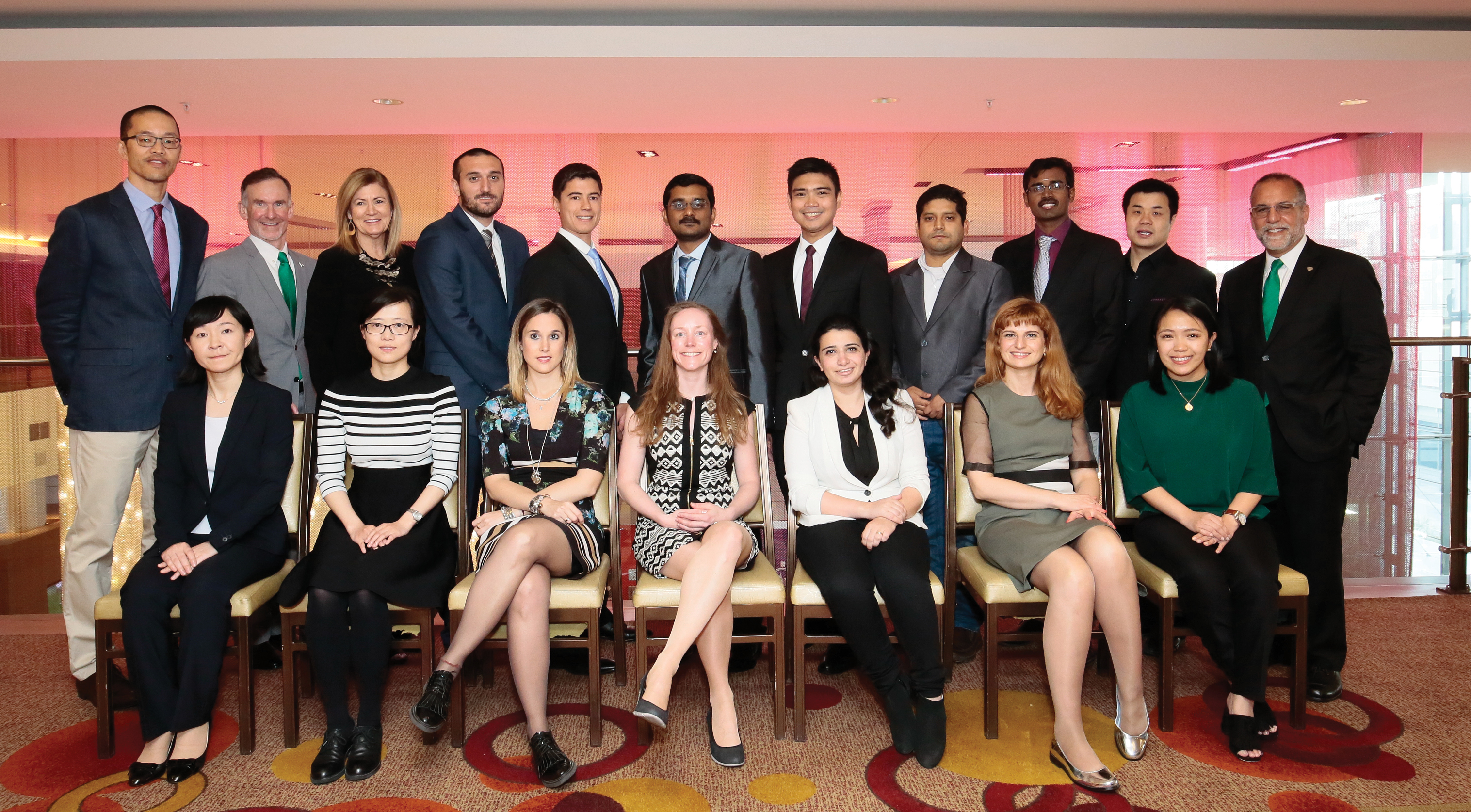 Group of physicians lined up smiling at the AAN Annual Meeting