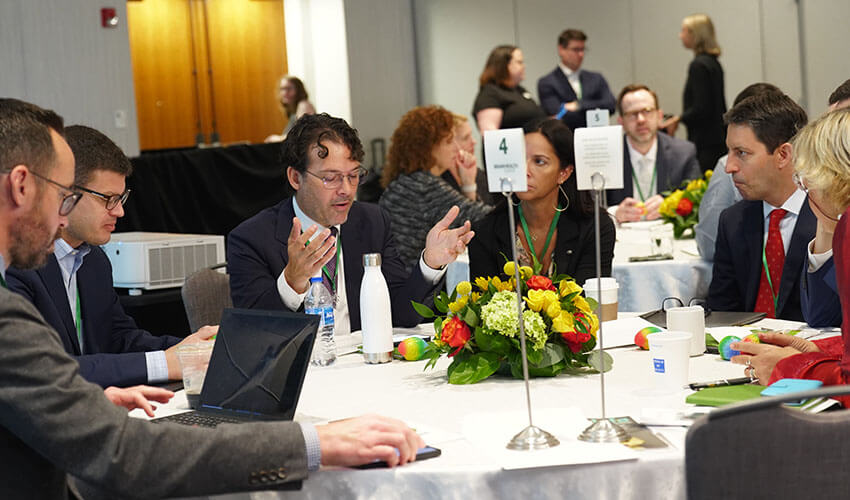 Keynote speaker and AAN Brain Health Committee member Daniel J. Correa, MD, MSc, FAAN, (third from the left) facilitates group discussion among fellow summit attendees on addressing health disparities.
