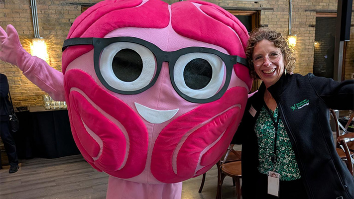 Meet Sarah Bellum, the AAN’s cheerful mascot who brings brain power and fun to our events.