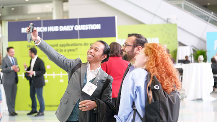 Diverse group of attendees posing for selfie at the AAN Annual Meeting