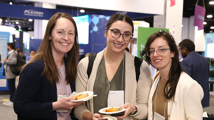 Participants enjoy food during the Exhibit Hall Networking Crawl. 